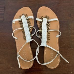 Barneys New York white sandals with gold tassels